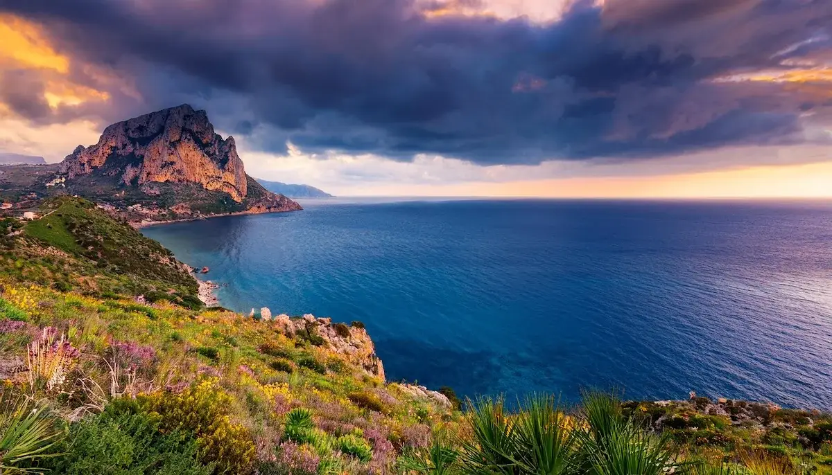 The Cofano headland above the sea in Sicily at dusk